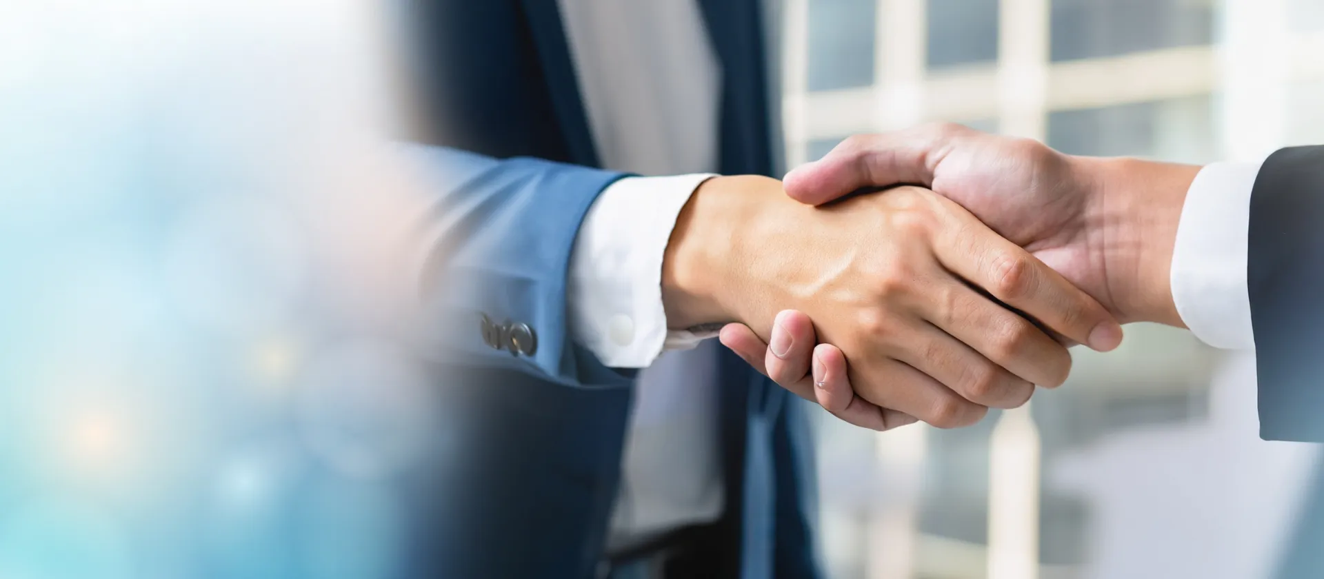 businessmen-making-handshake-with-partner-business-cooperation-dealing-panoramic-banner-copy-space