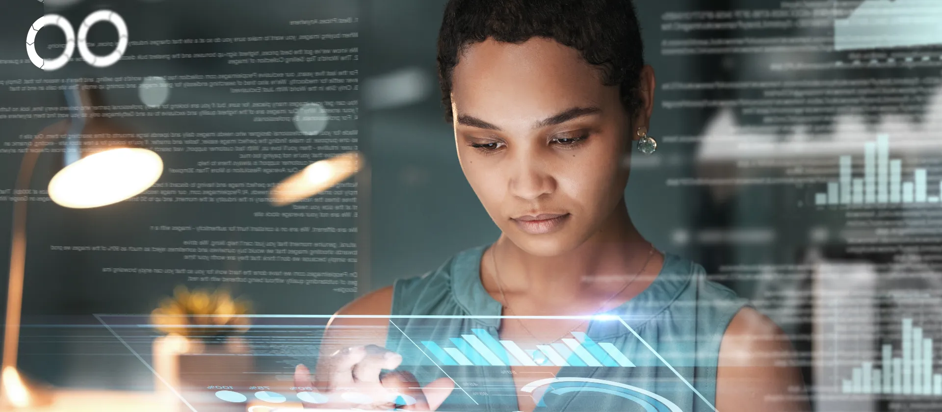 Person working on a tablet with holographic charts, data streams and analytic visualizations appearing around them – representing data management, data architecture, master data management and analytics strategies.