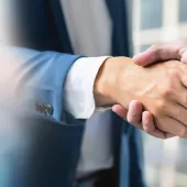 businessmen-making-handshake-with-partner-business-cooperation-dealing-panoramic-banner-copy-space